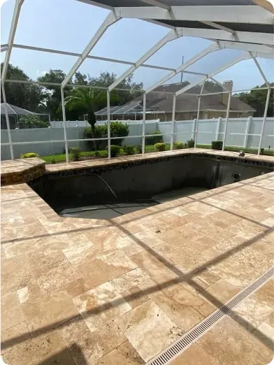 Screened-in pool deck finished with pavers